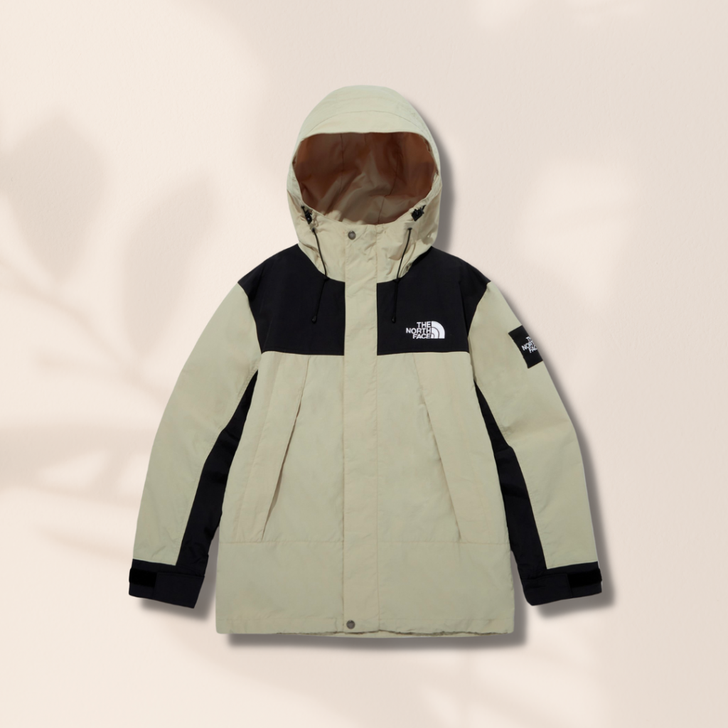 Beige and black, with The North Face's logo on the front, back and sleeves. A must have to stay warm and stylish for winter. The material is not overly thick so it's suitable for spring to early summer as well. It is waterproof and lightweight, many hiker's top choice!
