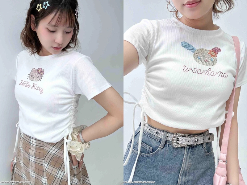 AS KNOW AS plus x Sanrio collaboration cropped t-shirt featuring character prints, rhinestone details, and side ribbons, accompanied by a matching acrylic keychain.