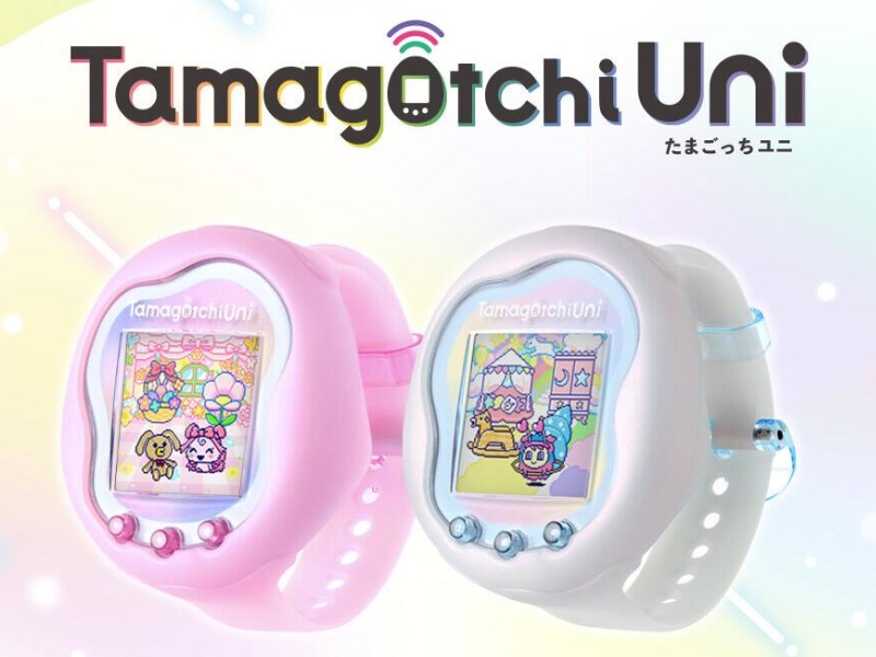 Premium Bandai Limited Edition Tamagotchi Uni virtual pet in Aurora Pink and Prism White colors, featuring Wi-Fi connectivity and Tamaverse gameplay.