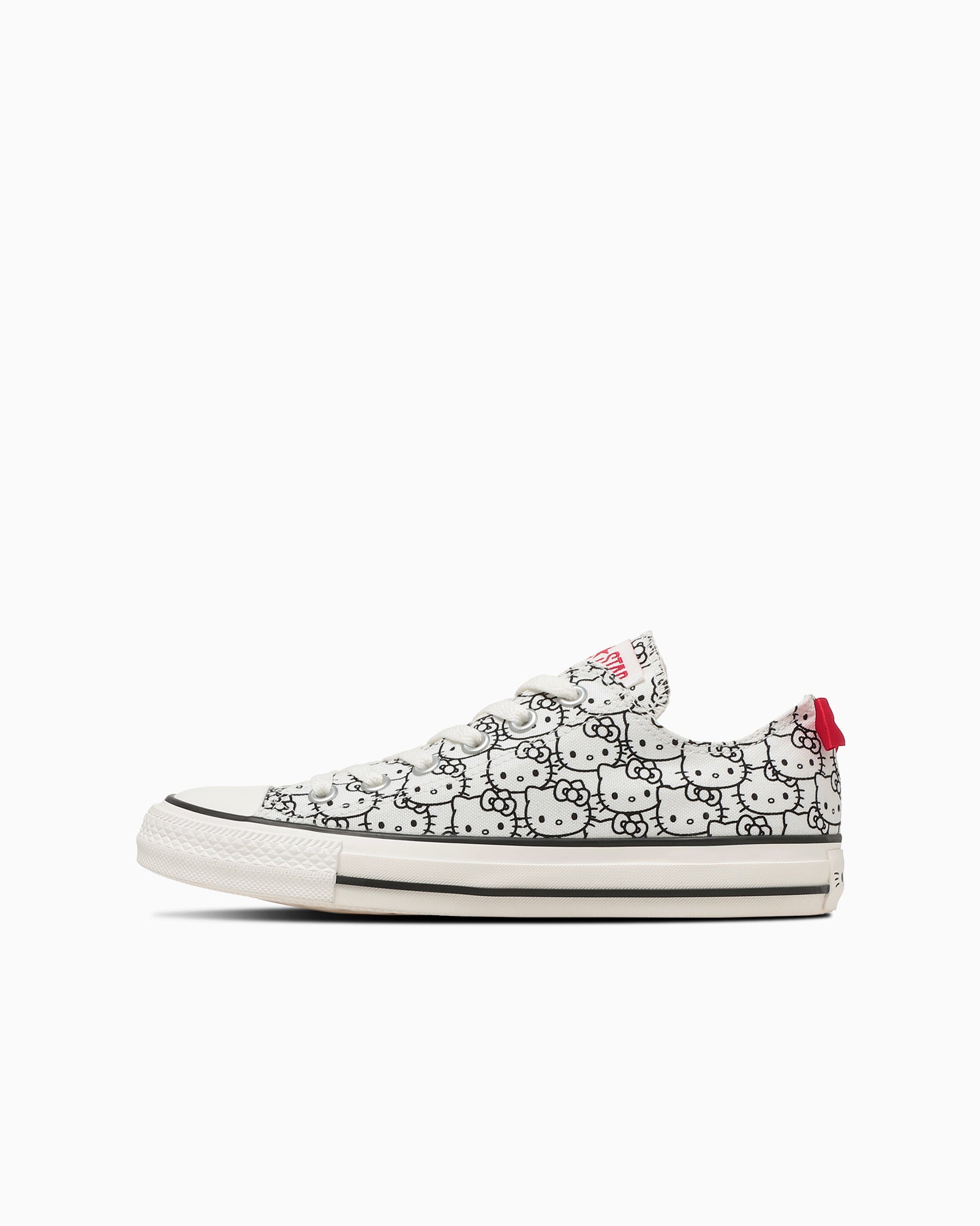 CONVERSE Japan x Sanrio ALL STAR OX Hello Kitty low-top canvas sneakers with all-over Hello Kitty face print upper and red ribbon heel detail