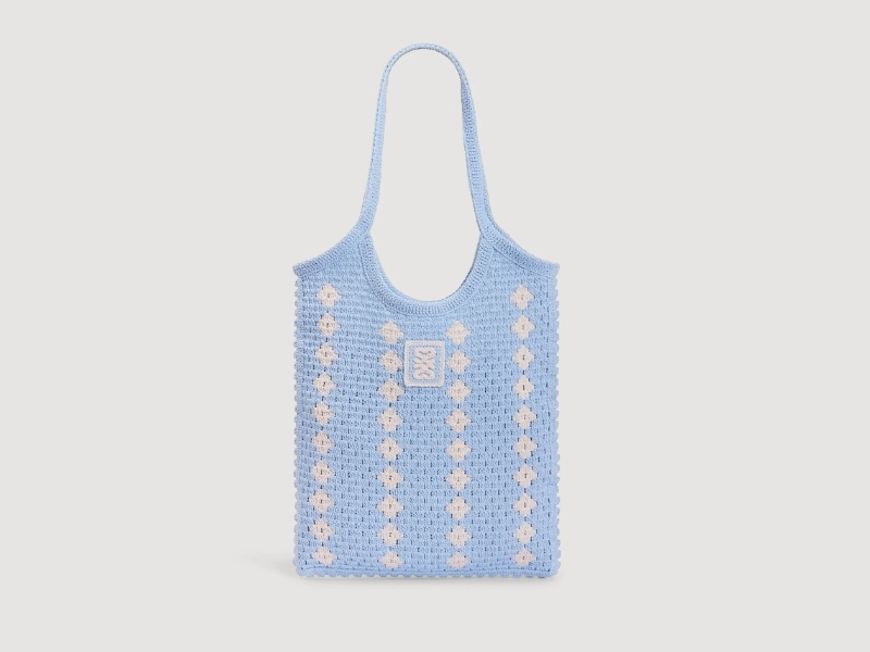Sandro two-tone crochet handbag with woven raffia-style body and contrast top handle.