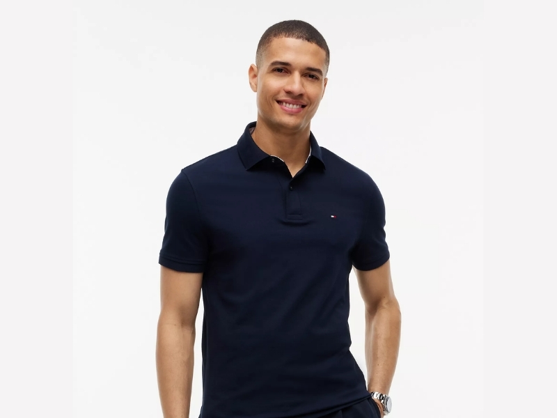 Tommy Hilfiger men's regular fit stretch pique polo shirt with embroidered tri-color flag logo on the chest.