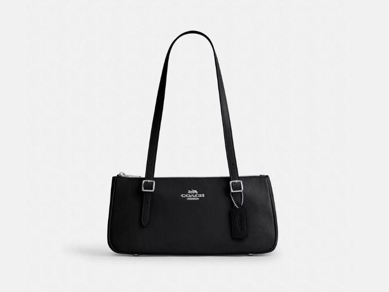 Black glazed leather COACH Asher shoulder bag featuring a horizontal silhouette and an adjustable strap.