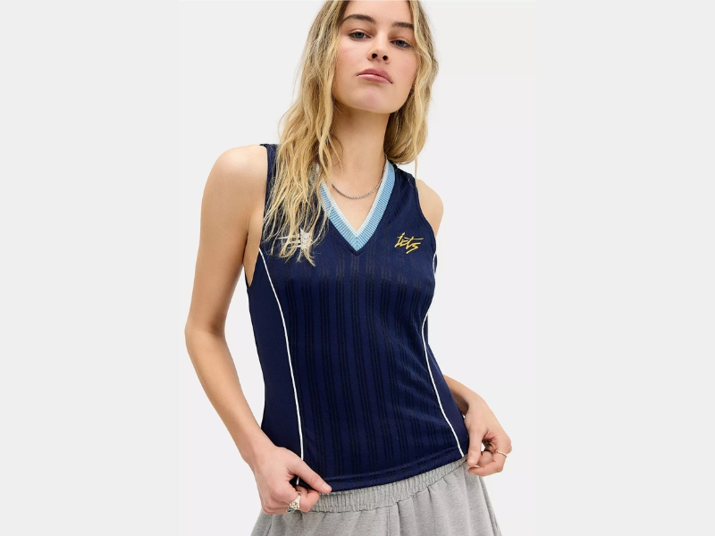 iets frans retro sports V-neck cropped tank top featuring subtle stripes, contrast piping, and an embroidered logo.
