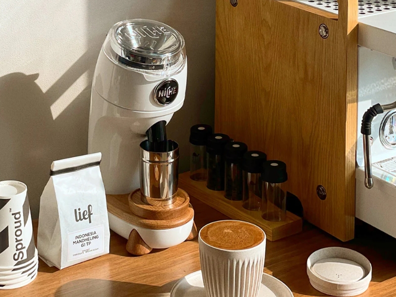 Niche Zero single-dose conical burr coffee grinder in white with oak accents